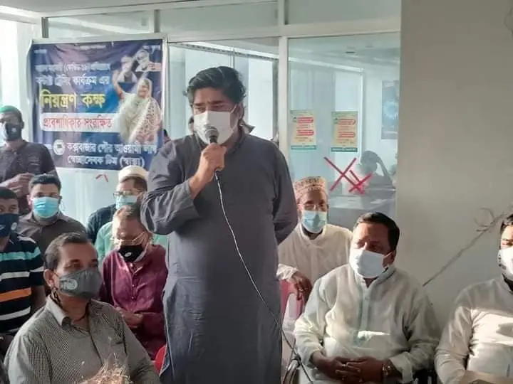 Person talking in a public gathering using mic