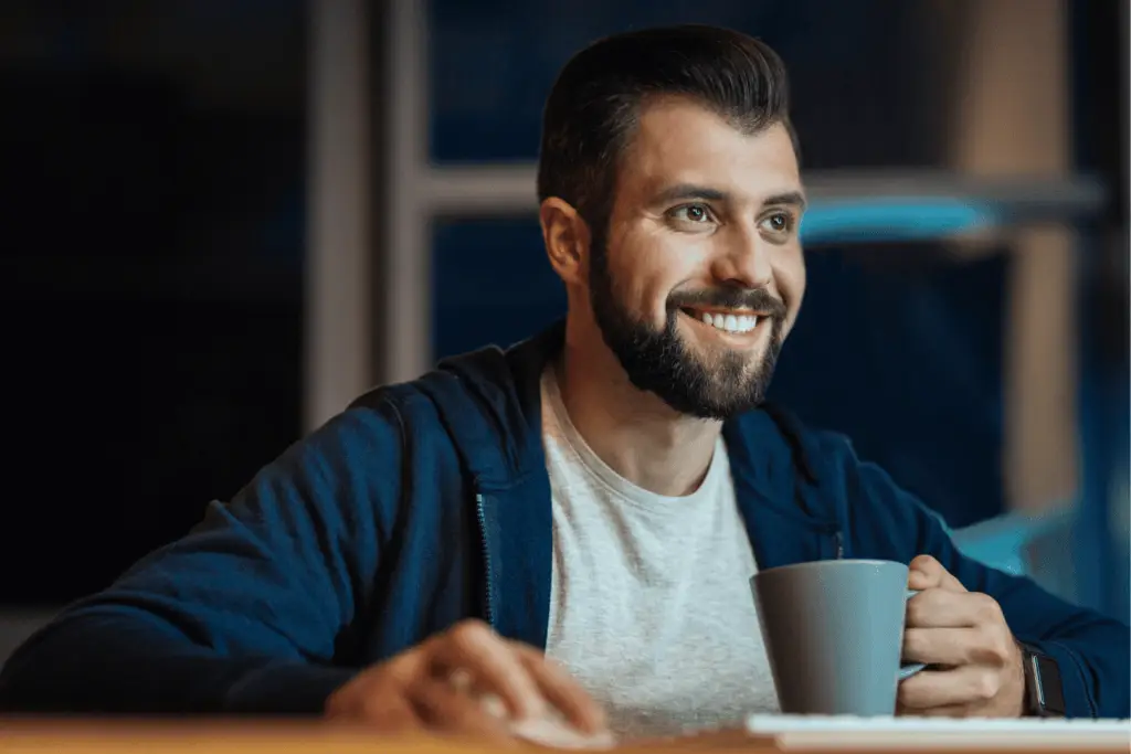 Smiling person using computer